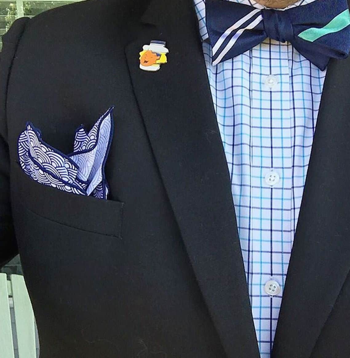 bow tie with charcoal suit and blue bow tie