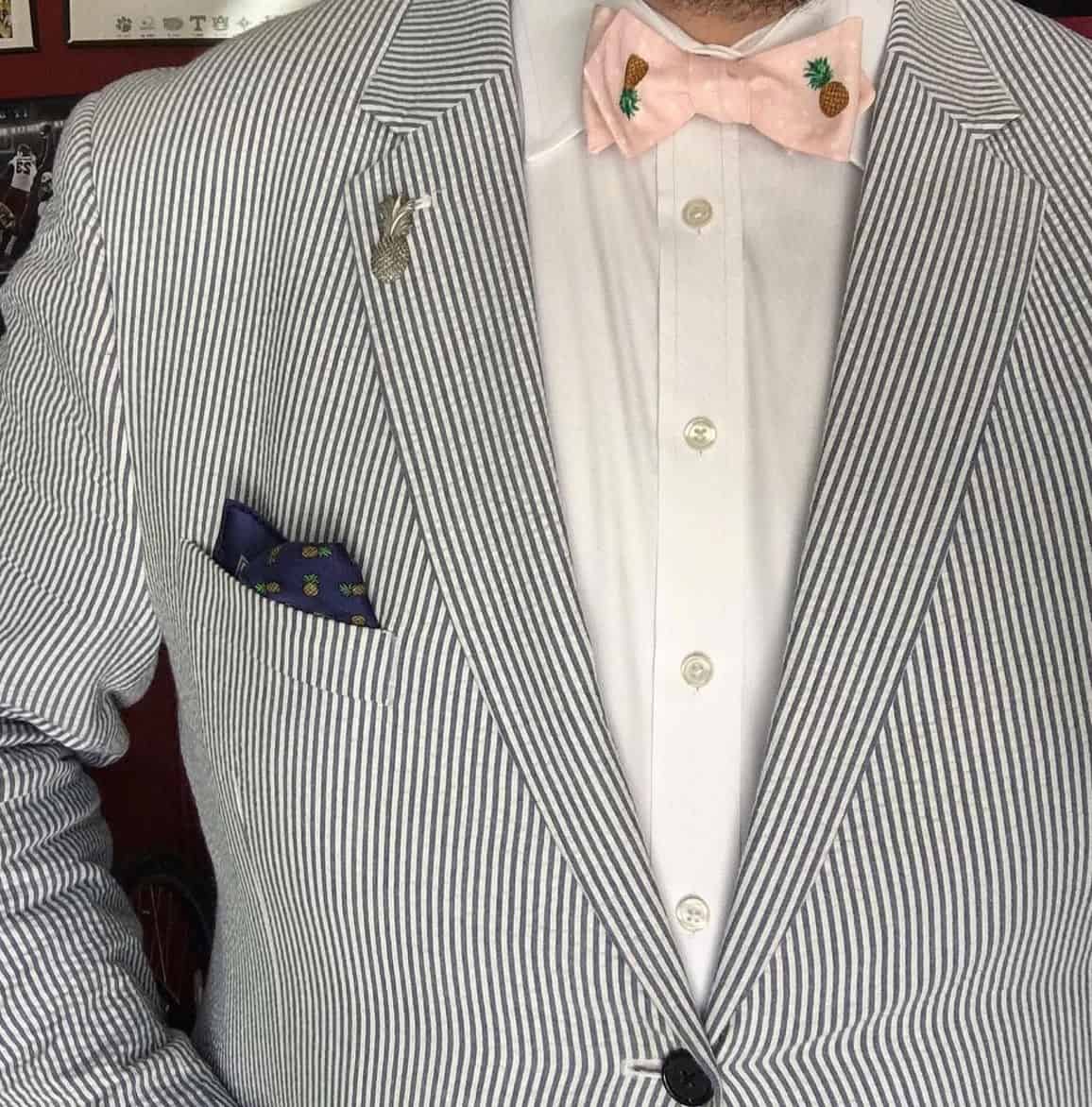 seersucker suit with pink bow tie