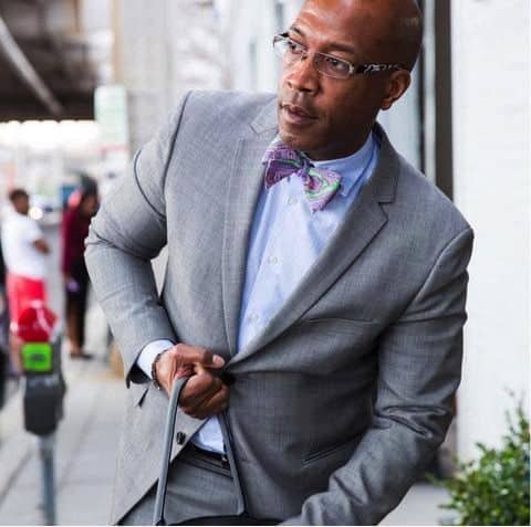 Gray Suit Jacket, Blue Shirt, And Bow Tie