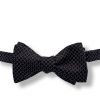 black jacquard italian silk bow tie that is self tie and shown tied