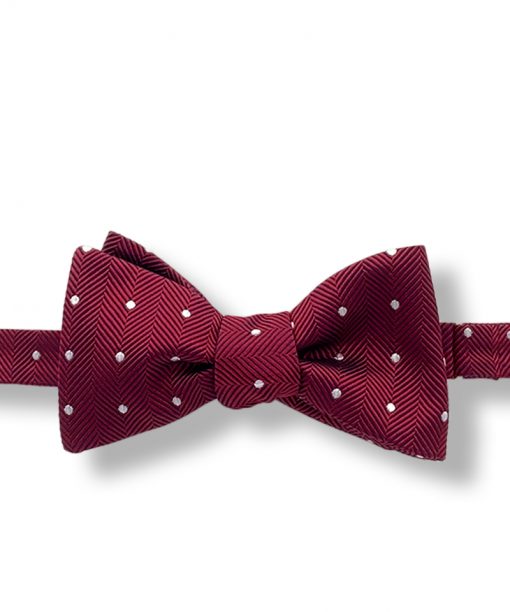 burgundy polka dot italian silk bow tie that is self tie and shown tied