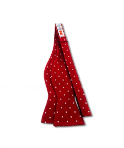 red and white polka dot silk self tie bow tie that is shown untied